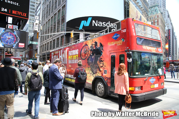 Bus adorned with adverts for Bat Out Of Hell The Musical, in Times Square, New York