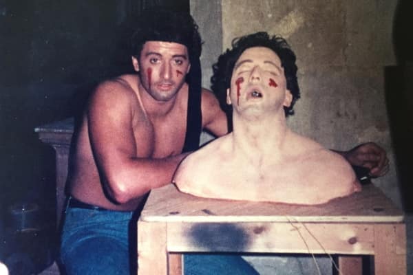 Sylvester Stallone lookalike with model